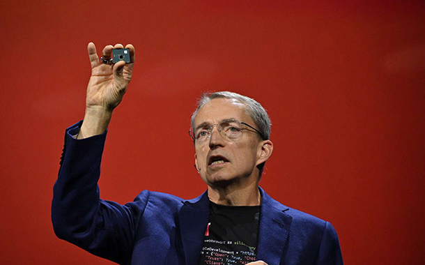 Intel CEO Pat Gelsinger displays a test chip package built with Universal Chiplet Interconnect Express